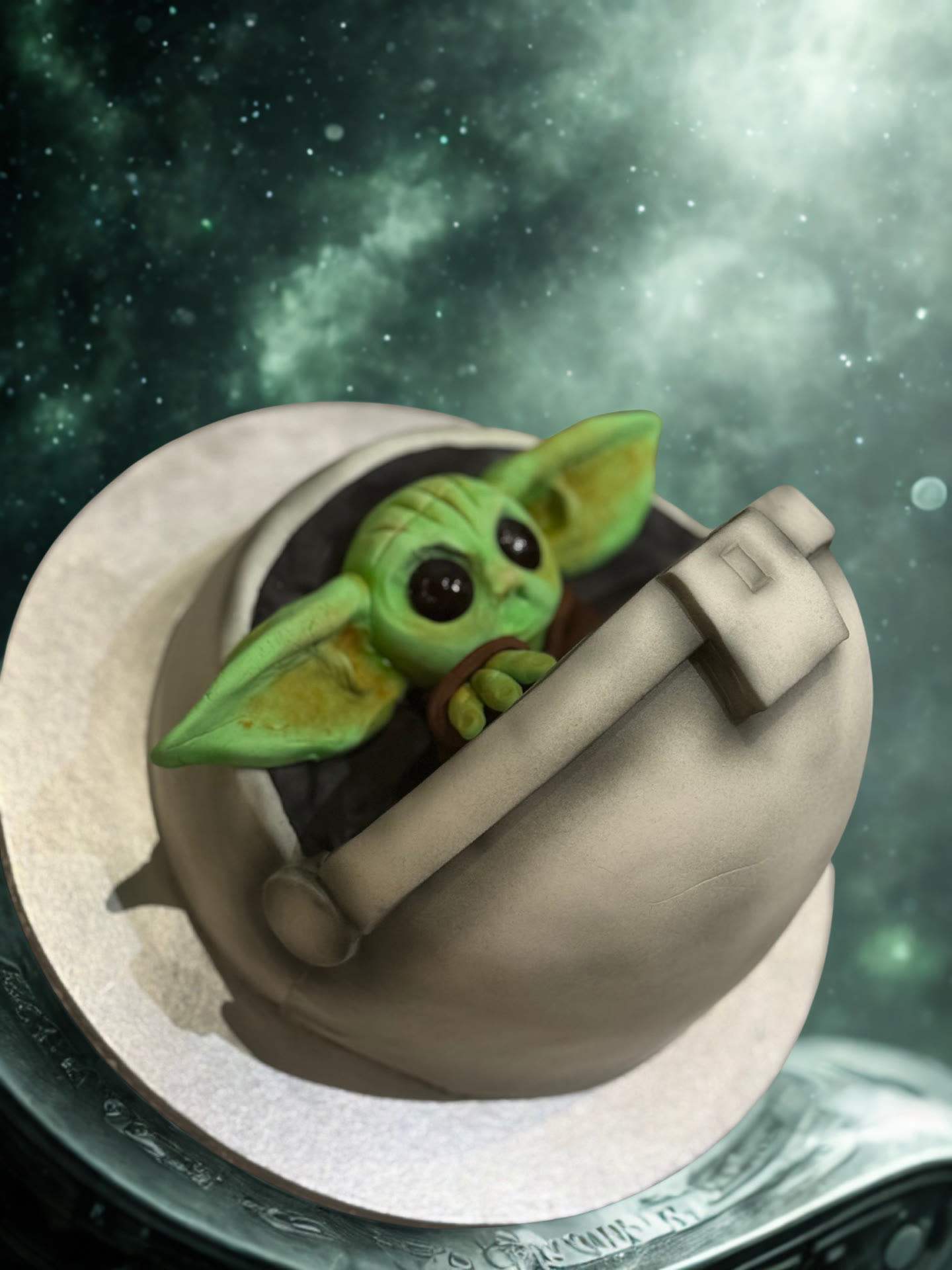A small sculpted figure asleep inside a modelled pod.